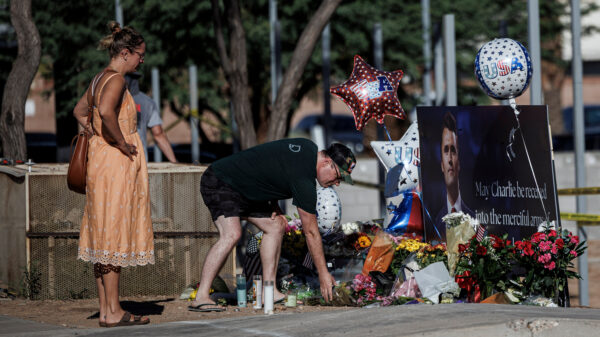 Mysterious Figures Behind Charlie Kirk Raise Questions Amid Shooting Incident